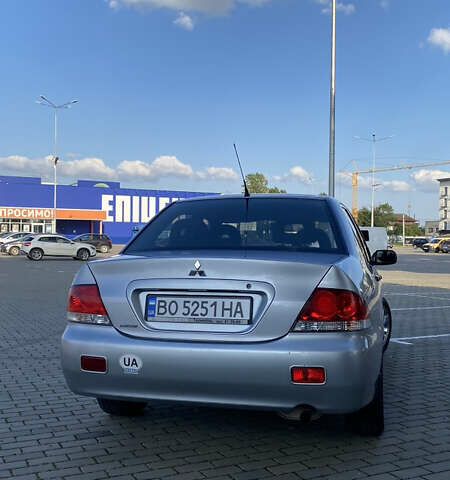 Сірий Міцубісі Lancer, об'ємом двигуна 1.58 л та пробігом 270 тис. км за 1999 $, фото 5 на Automoto.ua