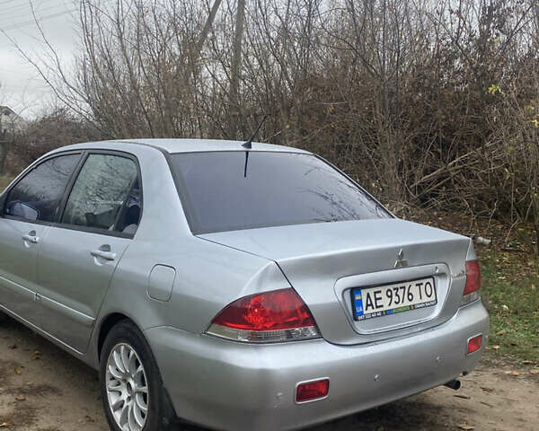 Серый Мицубиси Лансер, объемом двигателя 1.58 л и пробегом 210 тыс. км за 3900 $, фото 3 на Automoto.ua