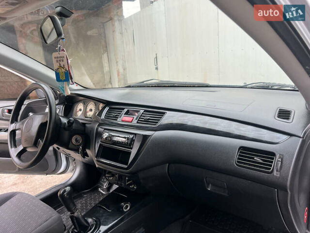 Сірий Міцубісі Lancer, об'ємом двигуна 1.6 л та пробігом 310 тис. км за 3350 $, фото 27 на Automoto.ua