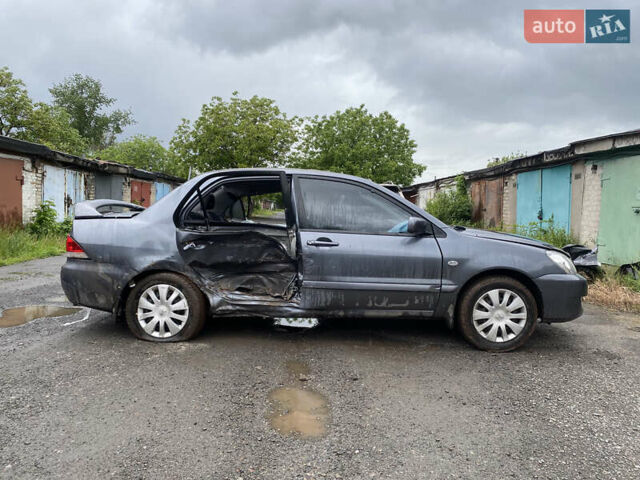 Сірий Міцубісі Lancer, об'ємом двигуна 1.58 л та пробігом 97 тис. км за 2000 $, фото 2 на Automoto.ua