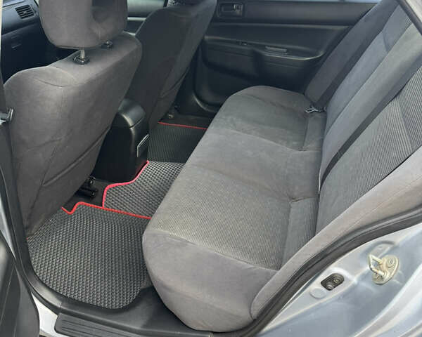 Серый Мицубиси Лансер, объемом двигателя 1.58 л и пробегом 260 тыс. км за 3500 $, фото 7 на Automoto.ua