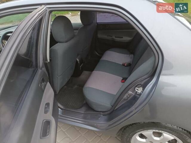 Сірий Міцубісі Lancer, об'ємом двигуна 1.58 л та пробігом 238 тис. км за 5500 $, фото 8 на Automoto.ua
