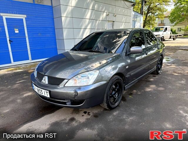 Серый Мицубиси Лансер, объемом двигателя 1.6 л и пробегом 300 тыс. км за 3850 $, фото 7 на Automoto.ua