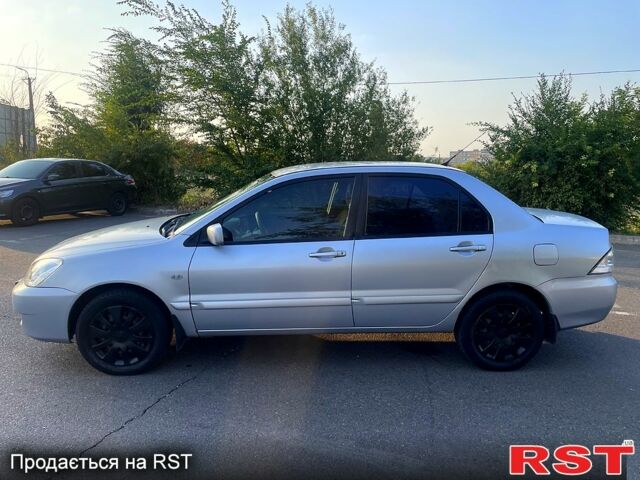 Сірий Міцубісі Lancer, об'ємом двигуна 1.6 л та пробігом 282 тис. км за 4100 $, фото 3 на Automoto.ua