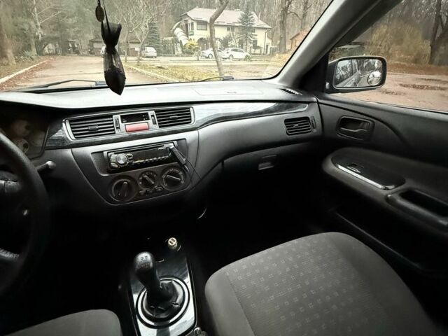 Сірий Міцубісі Lancer, об'ємом двигуна 1.6 л та пробігом 230 тис. км за 2799 $, фото 22 на Automoto.ua
