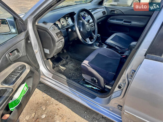 Сірий Міцубісі Lancer, об'ємом двигуна 1.58 л та пробігом 292 тис. км за 5000 $, фото 27 на Automoto.ua