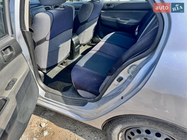 Сірий Міцубісі Lancer, об'ємом двигуна 1.58 л та пробігом 292 тис. км за 5000 $, фото 28 на Automoto.ua
