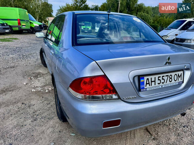 Сірий Міцубісі Lancer, об'ємом двигуна 1.58 л та пробігом 292 тис. км за 5000 $, фото 7 на Automoto.ua