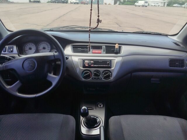 Серый Мицубиси Лансер, объемом двигателя 1.6 л и пробегом 250 тыс. км за 3600 $, фото 21 на Automoto.ua