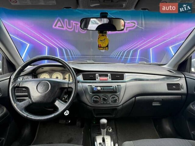 Сірий Міцубісі Lancer, об'ємом двигуна 1.58 л та пробігом 188 тис. км за 3799 $, фото 9 на Automoto.ua