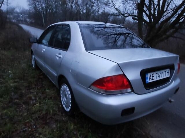 Серый Мицубиси Лансер, объемом двигателя 1.6 л и пробегом 235 тыс. км за 2850 $, фото 9 на Automoto.ua