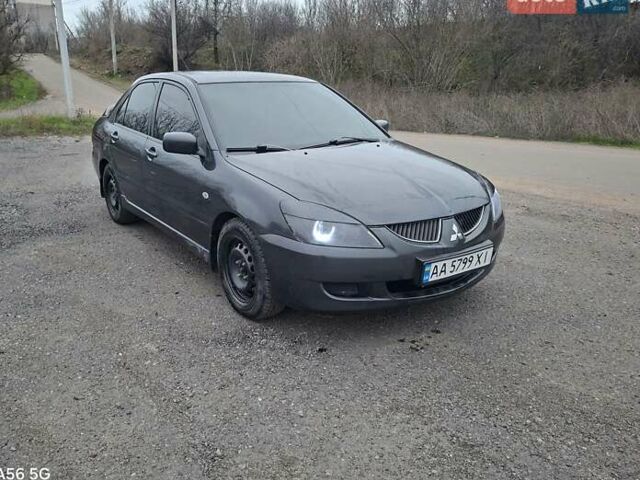 Серый Мицубиси Лансер, объемом двигателя 1.6 л и пробегом 305 тыс. км за 4000 $, фото 1 на Automoto.ua