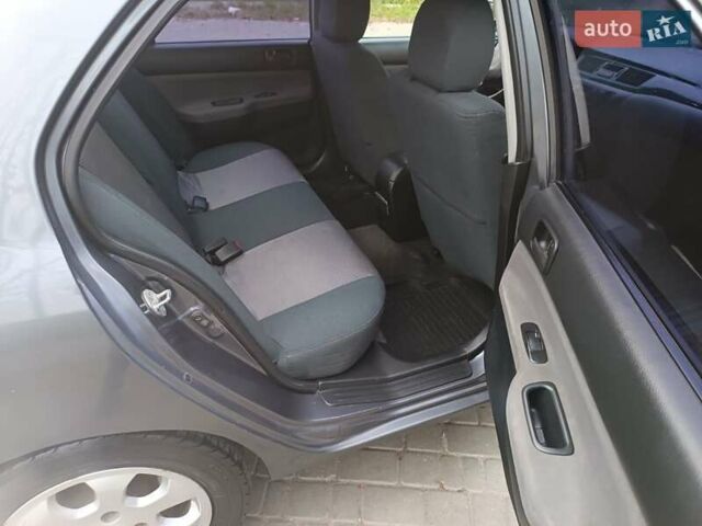 Сірий Міцубісі Lancer, об'ємом двигуна 1.58 л та пробігом 238 тис. км за 5500 $, фото 6 на Automoto.ua