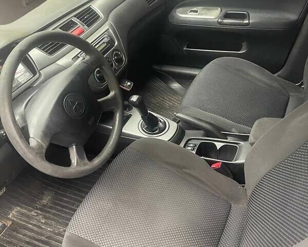 Сірий Міцубісі Lancer, об'ємом двигуна 1.58 л та пробігом 315 тис. км за 2350 $, фото 3 на Automoto.ua