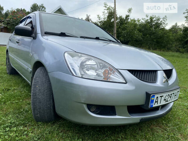 Сірий Міцубісі Lancer, об'ємом двигуна 1.58 л та пробігом 148 тис. км за 4450 $, фото 3 на Automoto.ua