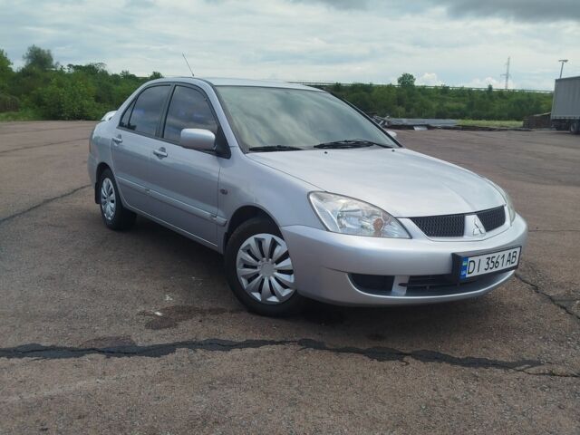 Серый Мицубиси Лансер, объемом двигателя 1.6 л и пробегом 250 тыс. км за 3600 $, фото 1 на Automoto.ua