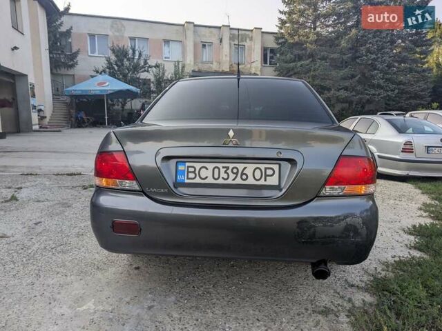 Сірий Міцубісі Lancer, об'ємом двигуна 1.58 л та пробігом 384 тис. км за 2500 $, фото 1 на Automoto.ua