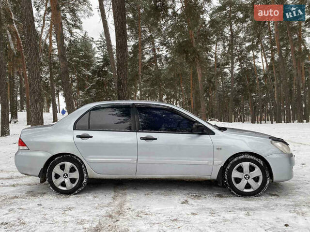 Серый Мицубиси Лансер, объемом двигателя 1.58 л и пробегом 225 тыс. км за 3950 $, фото 9 на Automoto.ua