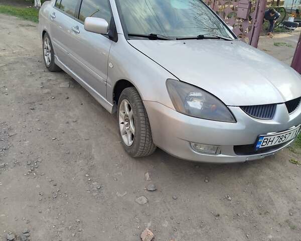 Серый Мицубиси Лансер, объемом двигателя 1.6 л и пробегом 199 тыс. км за 3300 $, фото 1 на Automoto.ua