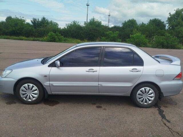 Серый Мицубиси Лансер, объемом двигателя 1.6 л и пробегом 250 тыс. км за 3600 $, фото 11 на Automoto.ua