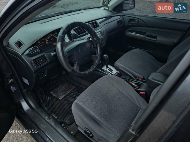 Серый Мицубиси Лансер, объемом двигателя 1.6 л и пробегом 305 тыс. км за 4000 $, фото 5 на Automoto.ua