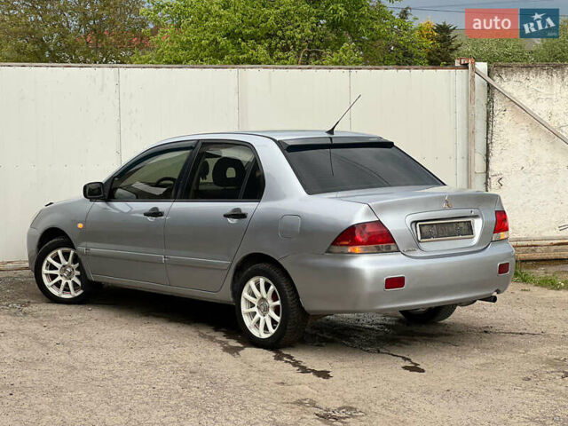 Сірий Міцубісі Lancer, об'ємом двигуна 1.6 л та пробігом 310 тис. км за 3350 $, фото 19 на Automoto.ua