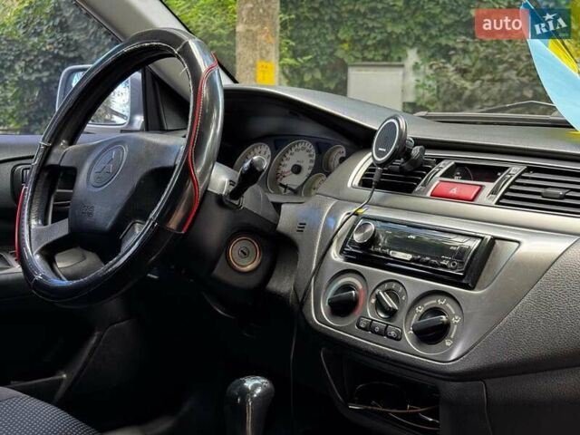 Серый Мицубиси Лансер, объемом двигателя 1.6 л и пробегом 196 тыс. км за 4490 $, фото 26 на Automoto.ua