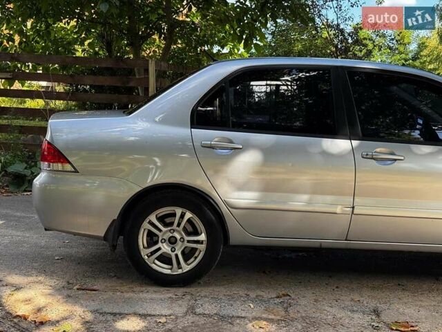 Серый Мицубиси Лансер, объемом двигателя 1.6 л и пробегом 196 тыс. км за 4490 $, фото 4 на Automoto.ua