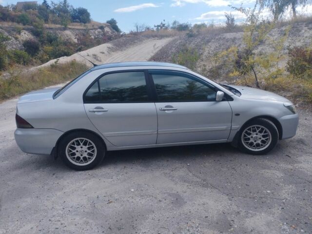 Сірий Міцубісі Lancer, об'ємом двигуна 1.6 л та пробігом 244 тис. км за 3300 $, фото 3 на Automoto.ua