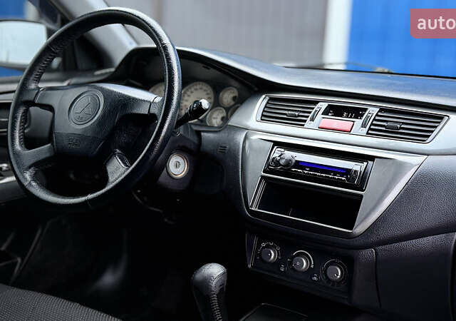 Серый Мицубиси Лансер, объемом двигателя 1.58 л и пробегом 224 тыс. км за 3499 $, фото 7 на Automoto.ua