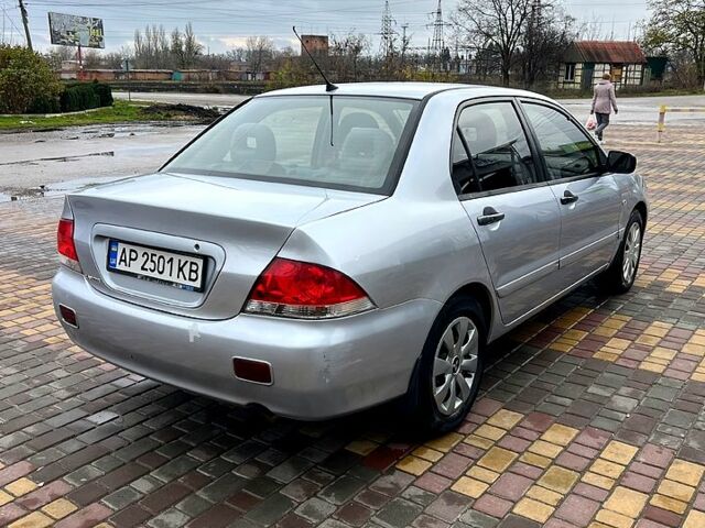 Сірий Міцубісі Lancer, об'ємом двигуна 1.6 л та пробігом 236 тис. км за 3800 $, фото 2 на Automoto.ua
