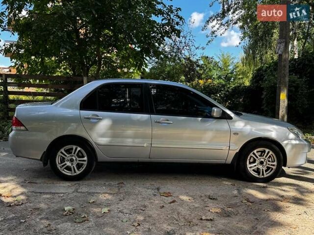 Серый Мицубиси Лансер, объемом двигателя 1.6 л и пробегом 196 тыс. км за 4490 $, фото 5 на Automoto.ua