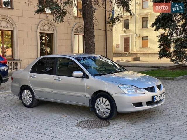 Серый Мицубиси Лансер, объемом двигателя 1.58 л и пробегом 200 тыс. км за 3850 $, фото 2 на Automoto.ua
