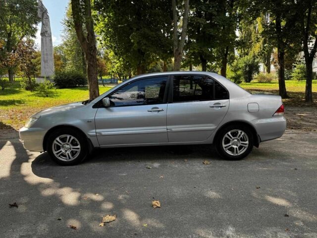 Серый Мицубиси Лансер, объемом двигателя 1.6 л и пробегом 196 тыс. км за 4390 $, фото 11 на Automoto.ua