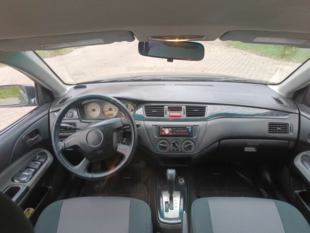 Серый Мицубиси Лансер, объемом двигателя 1.6 л и пробегом 242 тыс. км за 4600 $, фото 6 на Automoto.ua