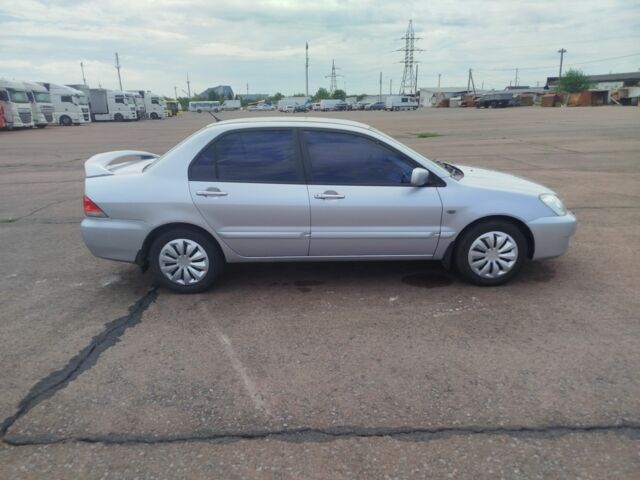 Серый Мицубиси Лансер, объемом двигателя 1.6 л и пробегом 250 тыс. км за 3600 $, фото 10 на Automoto.ua