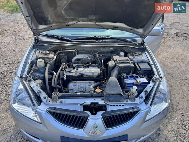 Сірий Міцубісі Lancer, об'ємом двигуна 1.58 л та пробігом 292 тис. км за 5000 $, фото 20 на Automoto.ua