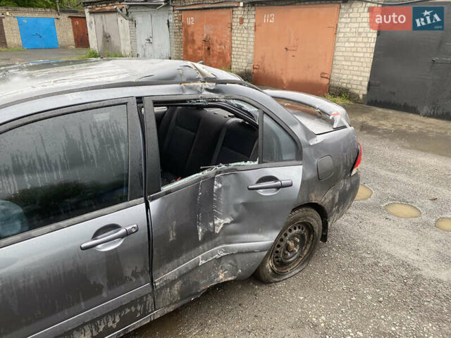 Сірий Міцубісі Lancer, об'ємом двигуна 1.58 л та пробігом 97 тис. км за 2000 $, фото 7 на Automoto.ua
