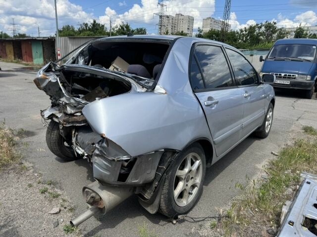 Серый Мицубиси Лансер, объемом двигателя 1.6 л и пробегом 240 тыс. км за 1199 $, фото 4 на Automoto.ua