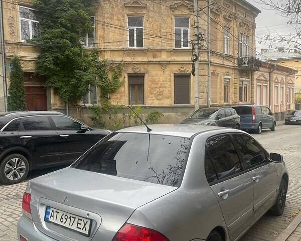 Сірий Міцубісі Lancer, об'ємом двигуна 1.58 л та пробігом 315 тис. км за 2350 $, фото 8 на Automoto.ua