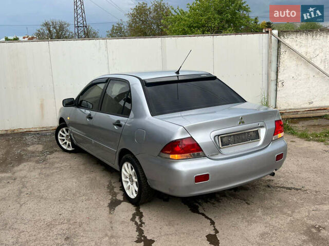 Сірий Міцубісі Lancer, об'ємом двигуна 1.6 л та пробігом 310 тис. км за 3350 $, фото 17 на Automoto.ua