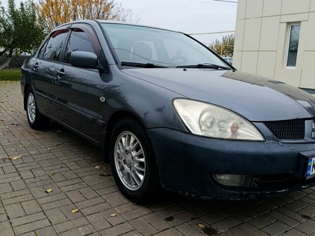 Серый Мицубиси Лансер, объемом двигателя 1.6 л и пробегом 100 тыс. км за 3500 $, фото 2 на Automoto.ua