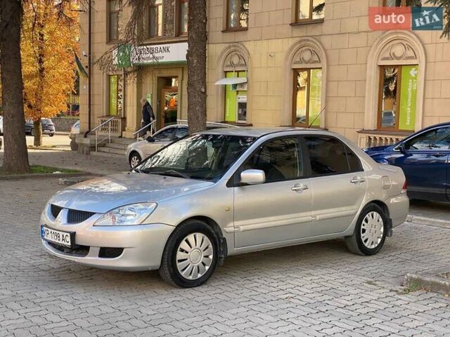 Серый Мицубиси Лансер, объемом двигателя 1.58 л и пробегом 250 тыс. км за 3750 $, фото 4 на Automoto.ua