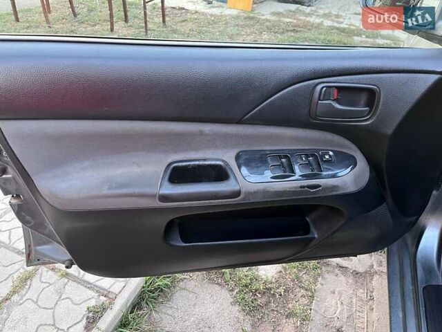 Серый Мицубиси Лансер, объемом двигателя 1.58 л и пробегом 290 тыс. км за 4000 $, фото 6 на Automoto.ua
