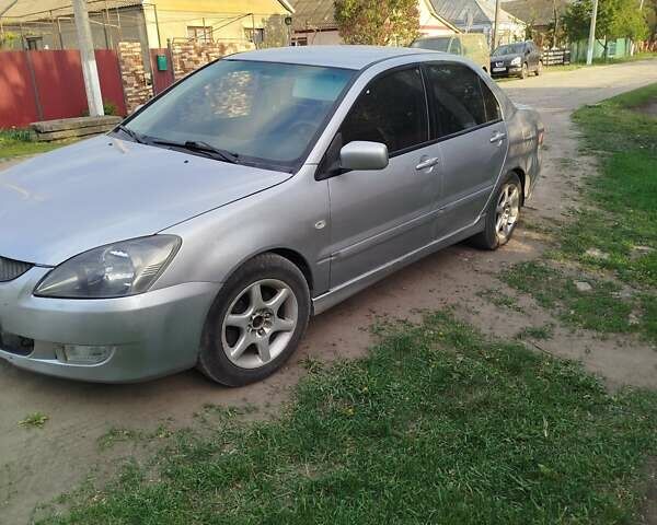 Серый Мицубиси Лансер, объемом двигателя 1.6 л и пробегом 199 тыс. км за 3300 $, фото 2 на Automoto.ua