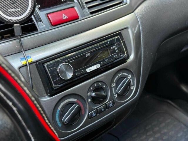 Серый Мицубиси Лансер, объемом двигателя 1.6 л и пробегом 196 тыс. км за 4390 $, фото 19 на Automoto.ua