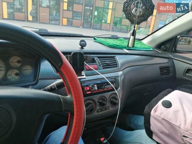 Мицубиси Лансер 2005 в Мукачеве на Automoto.ua Серый Мицубиси Лансер, объемом двигателя 1.6 л и пробегом 416 тыс. км за 4000 $, фото 7 на Automoto.ua