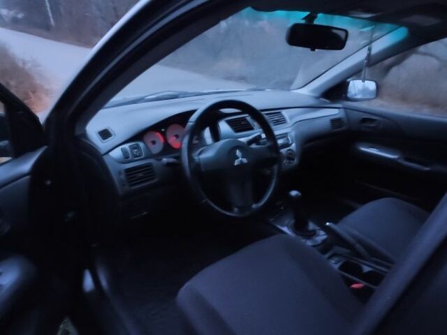 Серый Мицубиси Лансер, объемом двигателя 1.6 л и пробегом 235 тыс. км за 2850 $, фото 8 на Automoto.ua