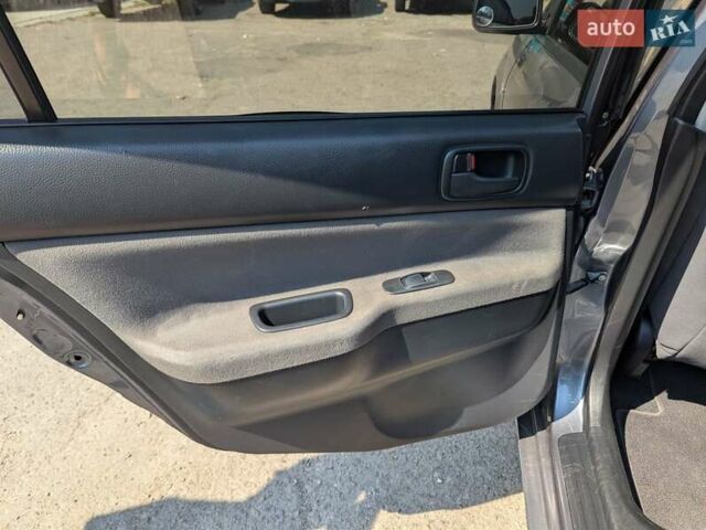 Сірий Міцубісі Lancer, об'ємом двигуна 1.58 л та пробігом 384 тис. км за 2500 $, фото 11 на Automoto.ua