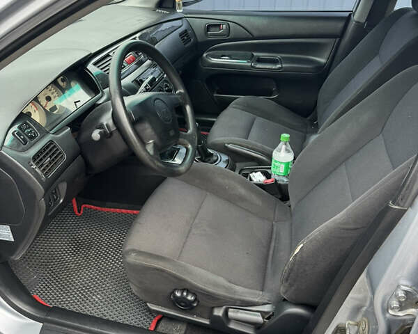 Серый Мицубиси Лансер, объемом двигателя 1.58 л и пробегом 260 тыс. км за 3500 $, фото 9 на Automoto.ua